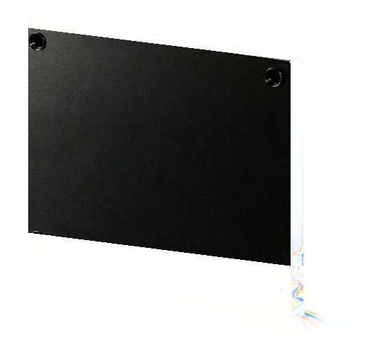 A glass-faced black plate with polished screws and a small refracted edge.