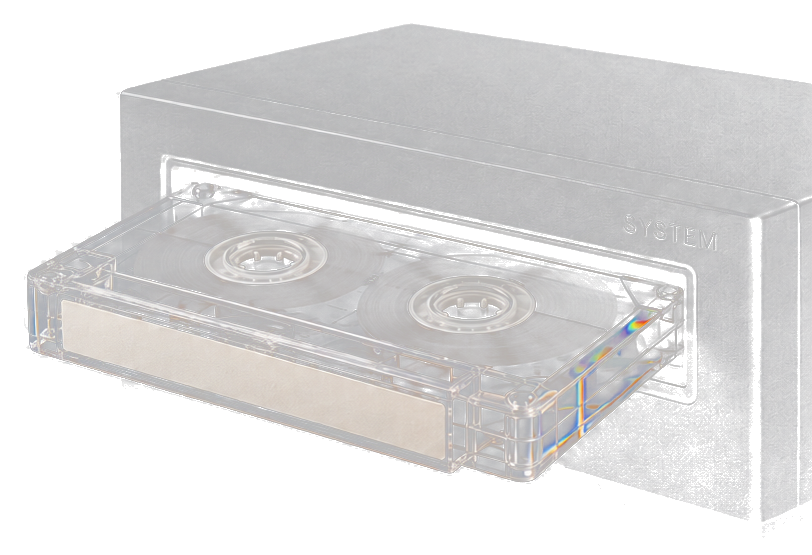 A clear cassette half-inserted into a black tape deck.